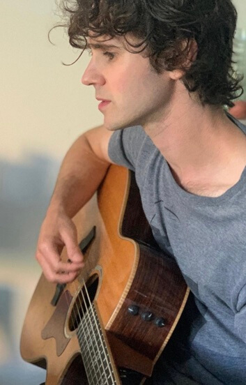 Connor Paolo playing guitar.